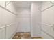 Spacious walk-in closet offering ample storage with rods and shelving at 11837 Se 165 Ave, Ocklawaha, FL 32179