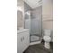 Bathroom featuring shower with translucent door, a toilet, and a vanity with a mirror at 10250 Sw 82Nd Ct, Ocala, FL 34481
