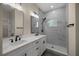 Modern bathroom with double vanity and walk-in shower at 10250 Sw 82Nd Ct, Ocala, FL 34481