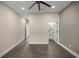 Empty bedroom with wood-look floors and access to bathroom at 10250 Sw 82Nd Ct, Ocala, FL 34481