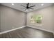 Bedroom with wood-look floors and a window view at 10250 Sw 82Nd Ct, Ocala, FL 34481