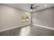 Bright bedroom with wood-look floors and a window at 10250 Sw 82Nd Ct, Ocala, FL 34481