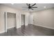 Empty bedroom with wood-look floors and large closets at 10250 Sw 82Nd Ct, Ocala, FL 34481