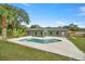 Gray house with a pool and a large backyard at 10250 Sw 82Nd Ct, Ocala, FL 34481