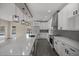 Modern kitchen with white cabinets, quartz countertops and island at 10250 Sw 82Nd Ct, Ocala, FL 34481
