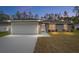 Beautiful single-Gathering home featuring a two-car garage and a well-maintained lawn, perfect for suburban living at 13234 Sw 113 Ln, Dunnellon, FL 34432