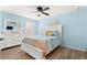 Light and airy bedroom with a queen bed and ceiling fan at 16414 Sw 14Th Ct, Ocala, FL 34473