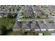 Overhead shot of residences showcasing manicured lawns and mature trees at 10817 Se 51St Ave, Belleview, FL 34420