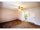 Comfortable bedroom with a ceiling fan, closet, and access to the en-suite bathroom, offering a private retreat at 10817 Se 51St Ave, Belleview, FL 34420