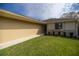 Charming single-story home with a well-maintained lawn, garden beds, and brick accents, providing comfortable suburban living at 10817 Se 51St Ave, Belleview, FL 34420