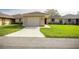 Charming single-story home with a well-maintained lawn and attached one car garage, providing comfortable suburban living at 10817 Se 51St Ave, Belleview, FL 34420