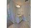 Well-lit bathroom with a granite countertop vanity and a large mirror at 11610 Sw 59Th Terrace, Ocala, FL 34476