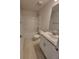Bright bathroom featuring a shower-tub combo, light-colored cabinets, and a granite countertop vanity at 11610 Sw 59Th Terrace, Ocala, FL 34476