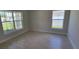 Inviting bedroom filled with natural light, neutral walls, and tile floors at 11610 Sw 59Th Terrace, Ocala, FL 34476
