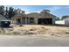 New construction home exterior featuring a two-car garage and neutral color palette at 11610 Sw 59Th Terrace, Ocala, FL 34476