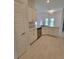 Well-designed kitchen with white cabinets, granite countertops, and stainless steel appliances at 11610 Sw 59Th Terrace, Ocala, FL 34476