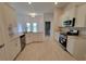 Modern kitchen with white cabinets, stainless steel appliances, and granite countertops at 11610 Sw 59Th Terrace, Ocala, FL 34476