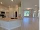 Modern kitchen featuring granite countertops, stainless steel appliances, and an open layout at 11610 Sw 59Th Terrace, Ocala, FL 34476
