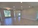 Bright open-concept living room with recessed lighting and large windows for ample natural light at 11610 Sw 59Th Terrace, Ocala, FL 34476