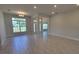 Bright open-concept living room with recessed lighting and large windows for ample natural light at 11610 Sw 59Th Terrace, Ocala, FL 34476