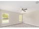 Bright and airy bedroom with neutral walls and carpeted flooring at 90 Bay Dr, Ocklawaha, FL 32179