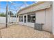 Private back patio with screened enclosure, brick pavers, and peaceful views for outdoor relaxation at 973 Buster Pl, The Villages, FL 32162