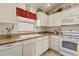 Bright kitchen with white cabinets, modern appliances, and stylish countertops at 973 Buster Pl, The Villages, FL 32162