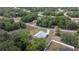Aerial view of a single Gathering home surrounded by lush greenery and other residential homes at 30 Maple Crse, Ocklawaha, FL 32179