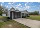 Charming single-story home featuring a screened porch, well-maintained lawn, and a storage shed at 30 Maple Crse, Ocklawaha, FL 32179