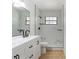 Modern bathroom featuring a marble tile shower and new vanity at 4360 Se 58Th Pl, Ocala, FL 34480