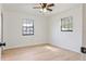 Bright bedroom with wood-look floors and two windows at 4360 Se 58Th Pl, Ocala, FL 34480