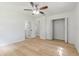 Bedroom featuring wood-look floors, a closet, and ceiling fan at 4360 Se 58Th Pl, Ocala, FL 34480