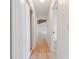 Hallway featuring wood-look floors and neutral walls at 4360 Se 58Th Pl, Ocala, FL 34480