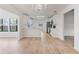 Bright, open kitchen boasts white cabinets, modern appliances, and beautiful wood floors at 4360 Se 58Th Pl, Ocala, FL 34480