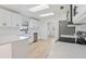 Bright modern kitchen featuring white cabinets, stainless appliances, and quartz countertops at 4360 Se 58Th Pl, Ocala, FL 34480