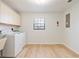 Functional laundry room with ample storage and modern washer and dryer at 4360 Se 58Th Pl, Ocala, FL 34480