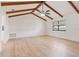 Large open living area featuring wooden beams and hard surface flooring at 4360 Se 58Th Pl, Ocala, FL 34480