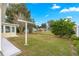 Enjoy the outdoors in this yard featuring a sunroom and mature landscaping at 4219 Ne 33Rd Ave, Ocala, FL 34479