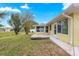A backyard features a wooden deck and an enclosed sunroom for versatile enjoyment at 4219 Ne 33Rd Ave, Ocala, FL 34479