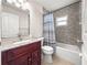 Bathroom featuring a bathtub with shower and a vanity with granite countertop at 4219 Ne 33Rd Ave, Ocala, FL 34479