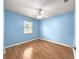 Bright bedroom with laminate wood flooring, ceiling fan and a window at 4219 Ne 33Rd Ave, Ocala, FL 34479