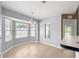 Sun-filled breakfast nook with wood floors, chandelier, and bay windows with a view at 4219 Ne 33Rd Ave, Ocala, FL 34479
