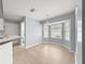 Charming breakfast nook with light hardwood floors, a chandelier, and a bay window at 4219 Ne 33Rd Ave, Ocala, FL 34479