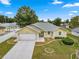 Charming single-story home with a well-maintained front yard and attached two-car garage at 4219 Ne 33Rd Ave, Ocala, FL 34479