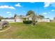 Well-manicured lawn and landscaping surround this lovely home, creating great curb appeal at 4219 Ne 33Rd Ave, Ocala, FL 34479