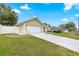 Charming home with a well-maintained lawn, long driveway, and manicured landscaping at 4219 Ne 33Rd Ave, Ocala, FL 34479