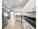 Bright kitchen with white cabinets, granite countertops, and stainless steel appliances at 4219 Ne 33Rd Ave, Ocala, FL 34479
