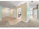 Inviting living room featuring neutral paint, plush carpet, and seamless access to the kitchen and outdoor spaces at 4219 Ne 33Rd Ave, Ocala, FL 34479