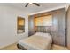 Bedroom offering a built-in Murphy bed with surrounding cabinets, and a neutral palette, creating a flexible living space at 455 Blue Cypress Dr, Groveland, FL 34736