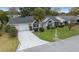 Charming single-story home features a well-manicured lawn, a paved driveway, and an attached garage at 8150 Sw 108Th St, Ocala, FL 34481